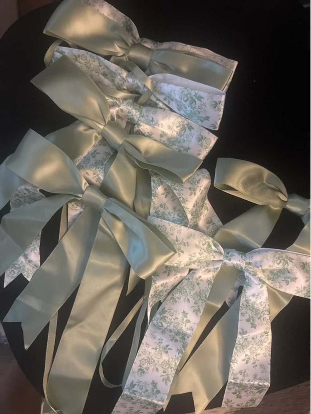 Eight green garland bows
